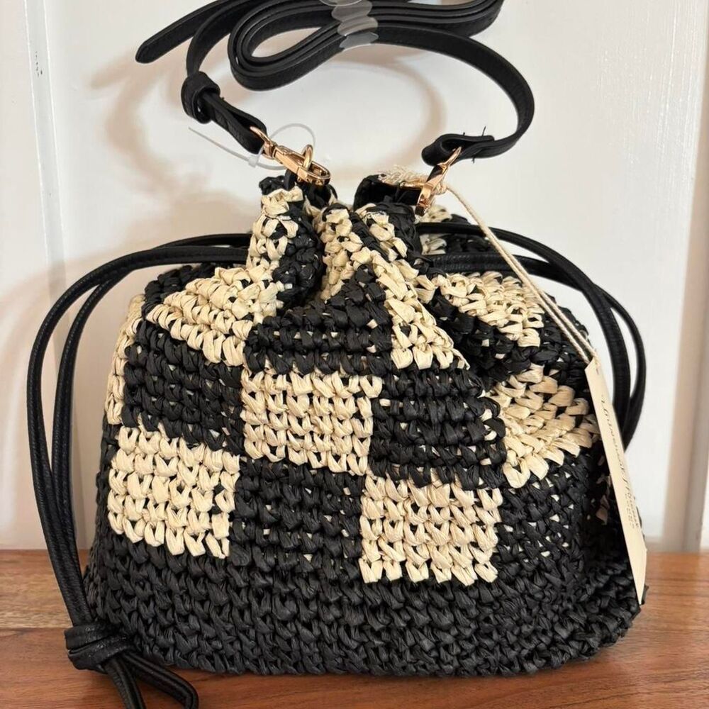 Women's Black and tan woven bucket bag with adjustable strap and Drawstring